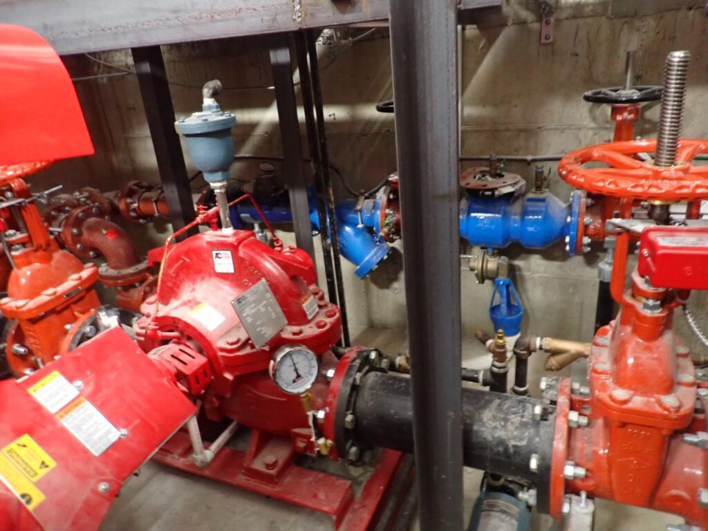 Why is regular inspection and testing of automatic sprinkler systems